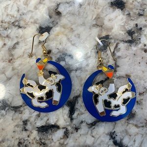 Vintage cow sitting on the moon holding a drink earrings